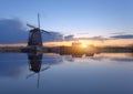 Silhouette of windmills at sunrise in Kinderdijk, Netherlands Royalty Free Stock Photo