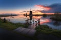 Silhouette of windmills at sunrise in Kinderdijk, Netherlands