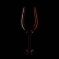 silhouette of a wine glass on a black background with white and red highlights Royalty Free Stock Photo