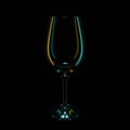 silhouette of a wine glass on a black background with yellow and blue highlights Royalty Free Stock Photo