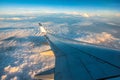 Silhouette wing of an airplane at sunrise view through the window Royalty Free Stock Photo