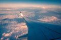 Silhouette wing of an airplane at sunrise view through the window Royalty Free Stock Photo