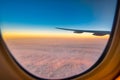 Silhouette wing of an airplane at sunset view through the window Royalty Free Stock Photo