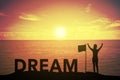 Silhouette of winning success woman at sunset or sunrise standing and raising up hand near flag with text DREAM Royalty Free Stock Photo