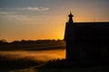 Silhouette of a Wisconsin barn in an early September morning