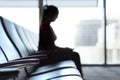 Silhouette woman in airport waiting room. Royalty Free Stock Photo