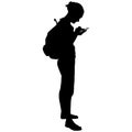 Silhouette of a woman with backpack with phone hands Royalty Free Stock Photo