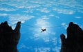 Silhouette of a woman balancing on rope between 2 cliffs businesswoman challenge, taking risk