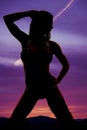 Silhouette of a woman in bikini on knees look side Royalty Free Stock Photo