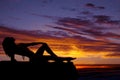 Silhouette of a woman in a bikini lay back look up Royalty Free Stock Photo