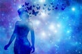 Silhouette of a woman with blue butterflies over starry background Royalty Free Stock Photo