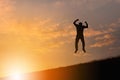 Silhouette of Woman Celebration Success Happiness on a Stone Evening Sky Sunset at Beach Background, Sport and active life Concept Royalty Free Stock Photo