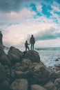 Silhouette of a woman and a child against the sea and sky Royalty Free Stock Photo