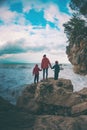 Silhouette of a woman and a children against the sea and sky Royalty Free Stock Photo