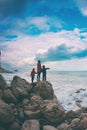 Silhouette of a woman and a children against the sea and sky Royalty Free Stock Photo