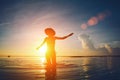 Silhouette of woman dancing in the ocean at sunset Royalty Free Stock Photo