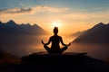 silhouette of a woman doing yoga in the mountains at sunset back view, meditation in nature Royalty Free Stock Photo