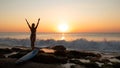 Silhouette of woman. Excited young woman raising arms at the beach in front of the ocean. View from back. Sunset at the beach. Royalty Free Stock Photo