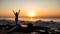 Silhouette of woman. Excited young woman raising arms at the beach in front of the ocean. View from back. Sunset at the beach. Royalty Free Stock Photo