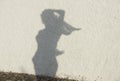 Silhouette of woman figure on natural wall background.Women figure on a wall, artistic photo. Contrast, silhouette of girl figure
