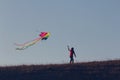 Silhouette Of woman flying kite