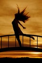 Silhouette of woman hair flying leg back Royalty Free Stock Photo