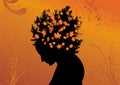 Silhouette of woman with hair from leaves