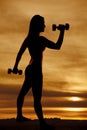 Silhouette woman hammer curl Royalty Free Stock Photo