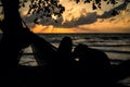 A silhouette woman on a hammock