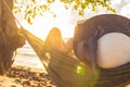 A silhouette woman on a hammock