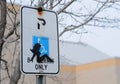 Silhouette of woman on handicap parking sign Royalty Free Stock Photo