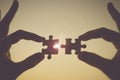 Hands connecting couple puzzle piece against sunrise effec Royalty Free Stock Photo