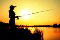 Silhouette of a woman in a hat engaged in sport fishing Royalty Free Stock Photo