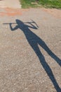 Silhouette of a woman holding a pickax