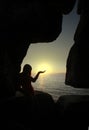 Silhouette of woman holding the sun Royalty Free Stock Photo