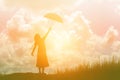 Silhouette of woman holding umbrella sunny day Royalty Free Stock Photo