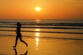 Silhouette of woman jogger running on sunset beach with reflection, fitness and sport Royalty Free Stock Photo