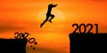 Silhouette woman jumping from 2020 cliff