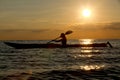 Silhouette of woman kayaking