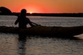 Silhouette of woman kayaking