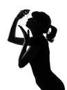 Silhouette woman kissing her perfume Royalty Free Stock Photo