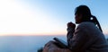 Silhouette of woman kneeling down praying for worship God at sky background. Christians pray to jesus christ for calmness. In Royalty Free Stock Photo