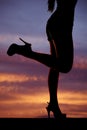 Silhouette woman legs kicked back sunset Royalty Free Stock Photo