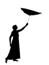 Silhouette of woman in long skirt with inside out umbrella, catching dreams, falling stars. Royalty Free Stock Photo