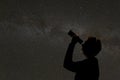 Silhouette of woman looking at stars Royalty Free Stock Photo