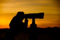 Silhouette of Woman Looking Through Telescope