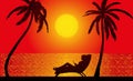 Silhouette of a woman lying on a couch and palm trees against the backdrop of the setting sun over the sea Royalty Free Stock Photo