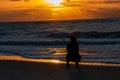 Silhouette of a woman on Orange beach in Alabama, USA during sunset Royalty Free Stock Photo