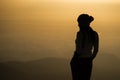 Silhouette of a woman photographer standing Royalty Free Stock Photo