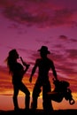 Silhouette of a woman with a pistol hair blow cowboy